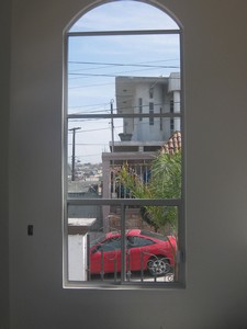 ventana de arco con fijos y ventana corrediza 